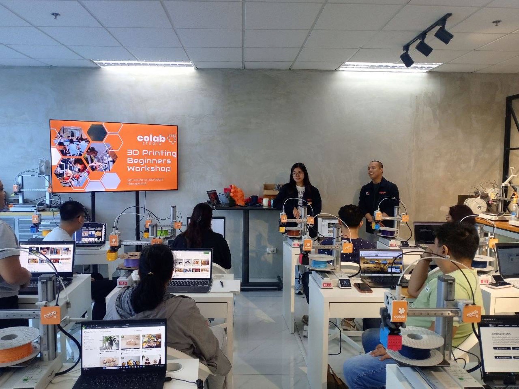 CoLab Studio Beginner 3D Printing Workshop session with participants and 3D printers